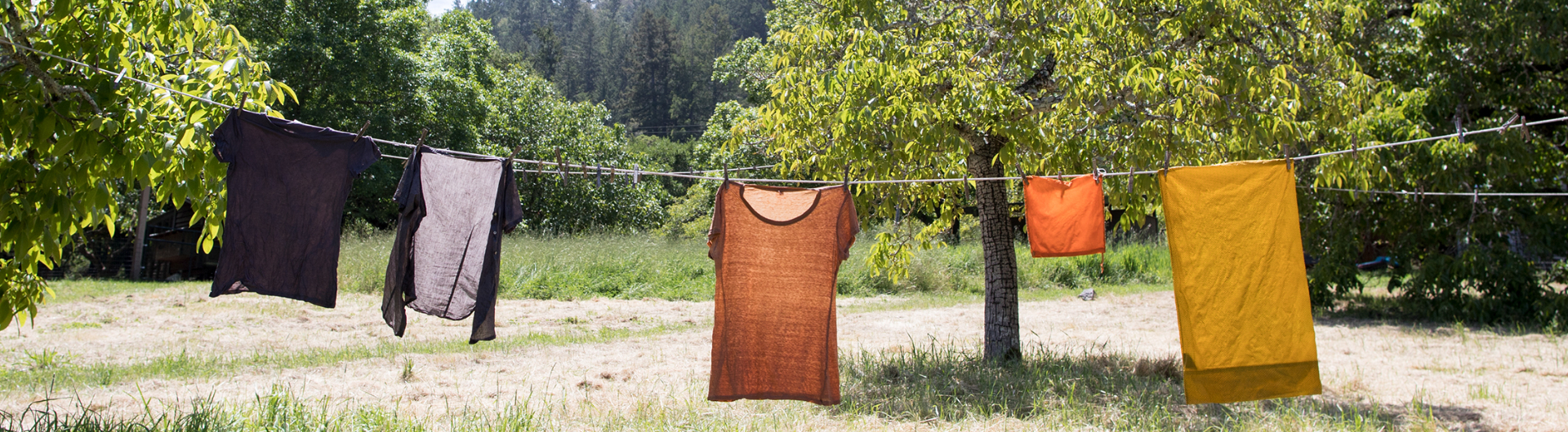 naturally dyed clothes on a clothes line