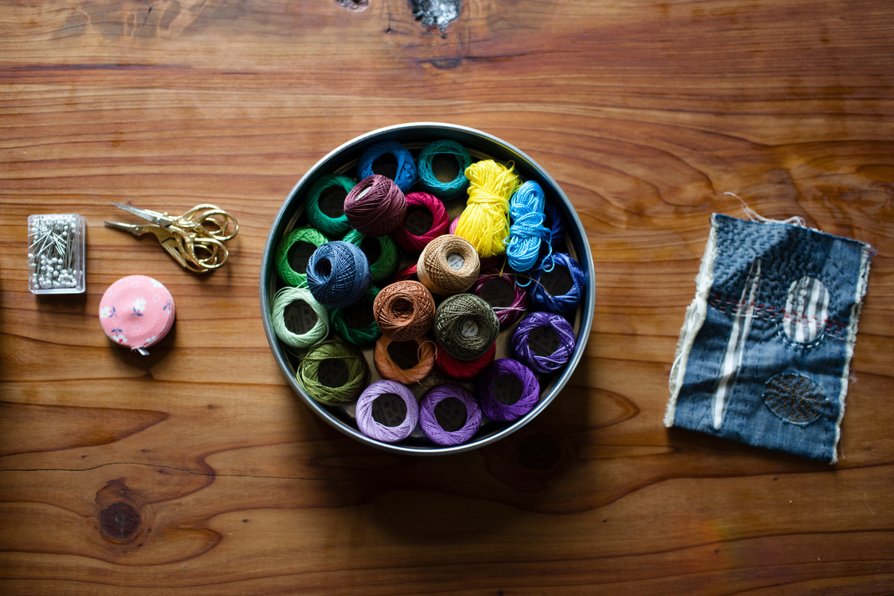 yarn, scissors and material swatch for mending
